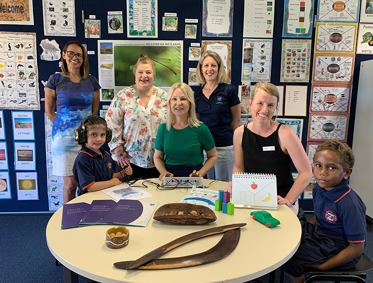 Onslow School Principal Jacqueline Barry, Education and Training Minister Sue Ellery, Chevron Australia Wheatstone Plant Manager Deanne Renting, Telethon Speech and Hearing Head of Marketing Belinda Leksas and Speech Pathologist Nicole Hadlow and Onslow students Macie Gusthart and Richard Melissen try out audiology and speech equipment at Onslow School.