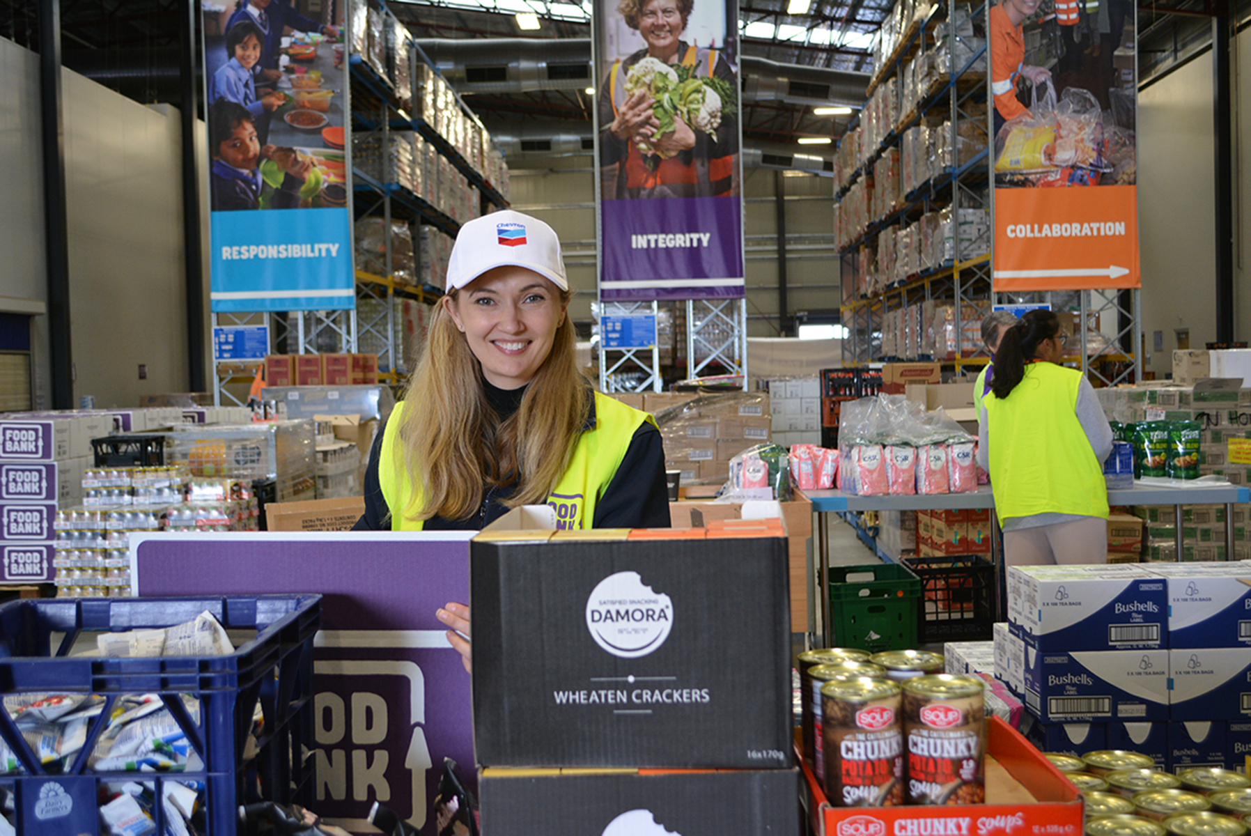 Chevron employee volunteering at Foodbank WA. Chevron employee volunteering at Foodbank WA.